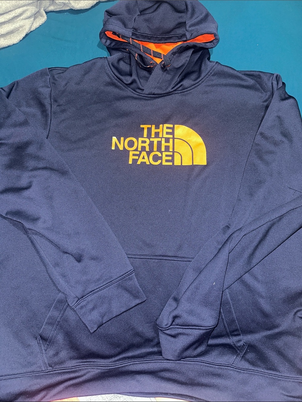 The North Face Black Hoodie with Orange Logo and Lined Hood